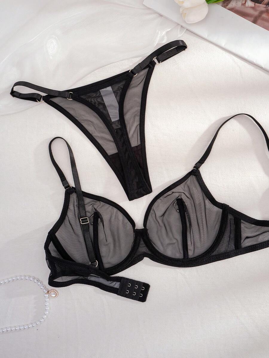 Black sheer 2-piece lingerie set for women featuring a backless underwire bra with clear straps and a matching low-rise thong.