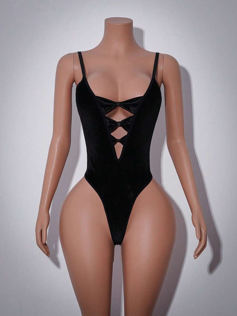 Black backless sexy bodysuit featuring a flocked patchwork design, adjustable spaghetti straps, and sleeveless silhouette.