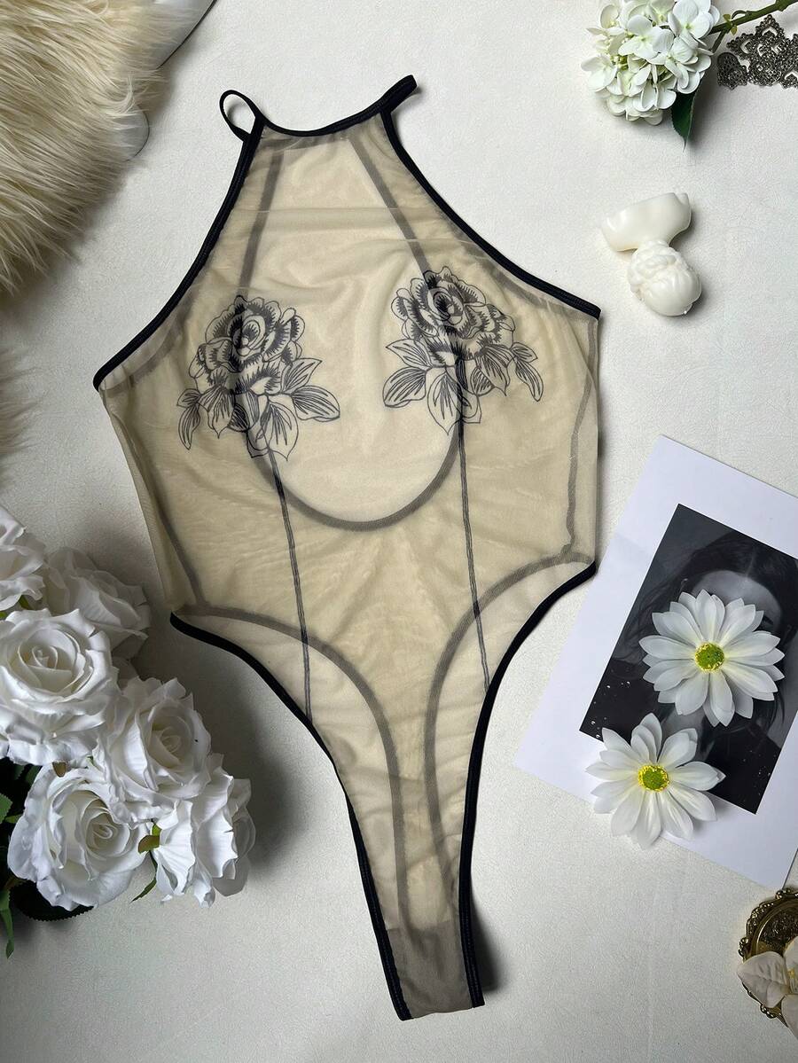 Women's sheer floral mesh teddy camisole featuring cut-out backless design, round neck, adjustable straps, and thong panty in burgundy.
