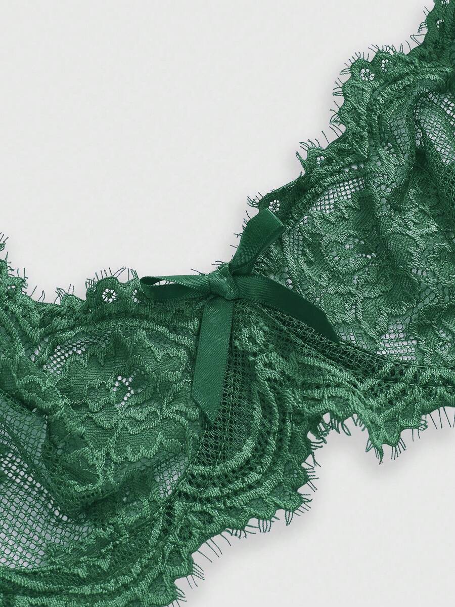 Black sheer floral lace plunge bra featuring underwire support, unlined triangle cups, adjustable straps, and a backless design for women.