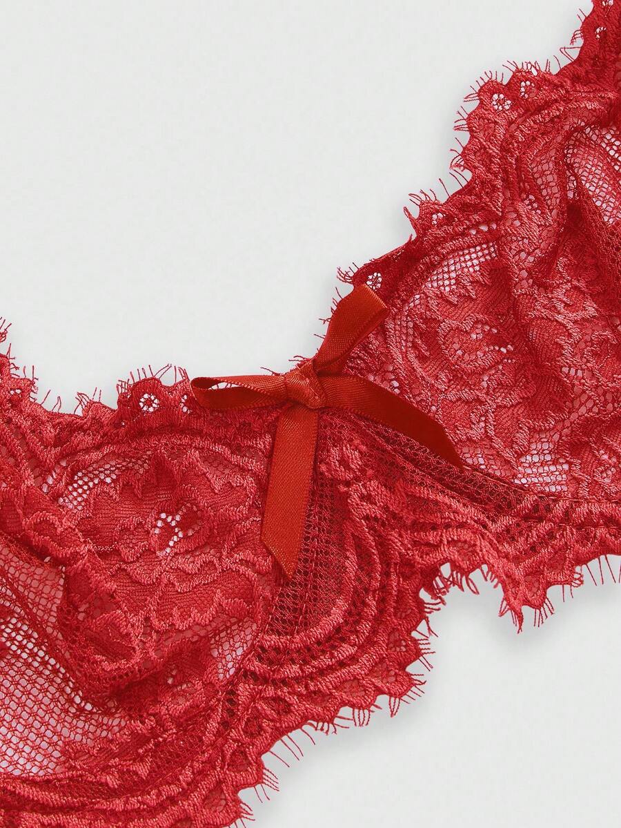 Black sheer floral lace plunge bra featuring underwire support, unlined triangle cups, adjustable straps, and a backless design for women.