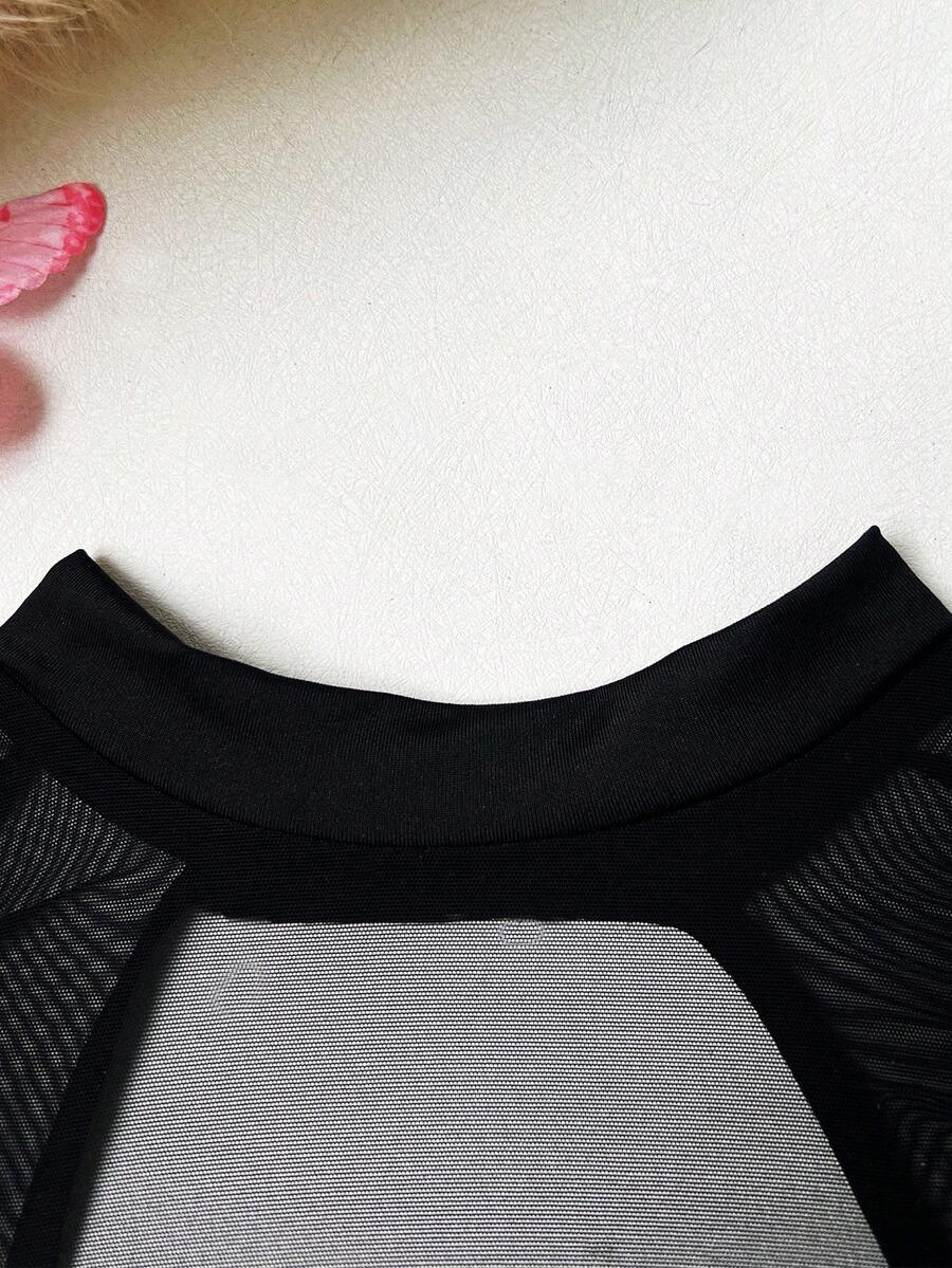 Black sheer cut out lingerie set including triangle cup underwire bralette with adjustable straps and low rise thong panty.