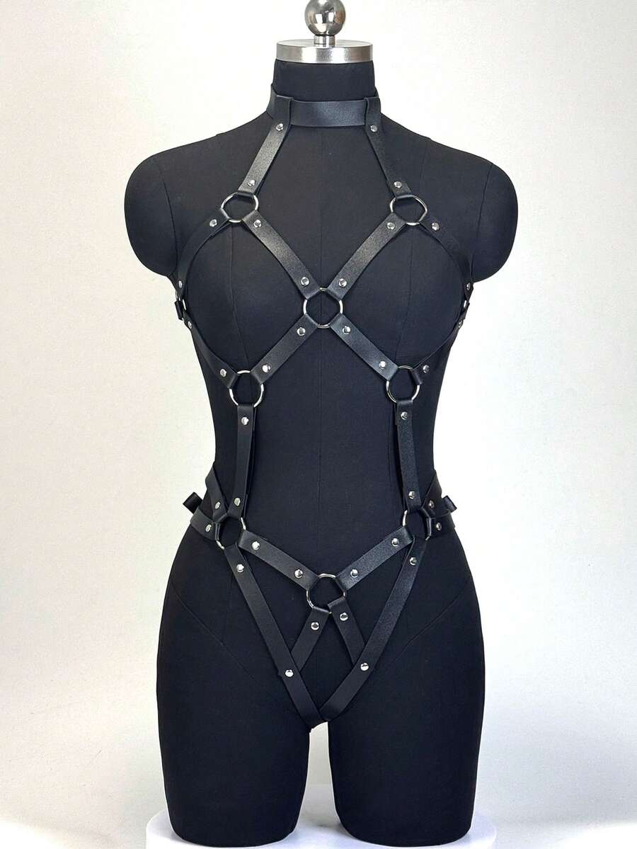 Black PVC leather harness lingerie set for women featuring ring details, restraint straps, thigh garters, and goth Y2K style.