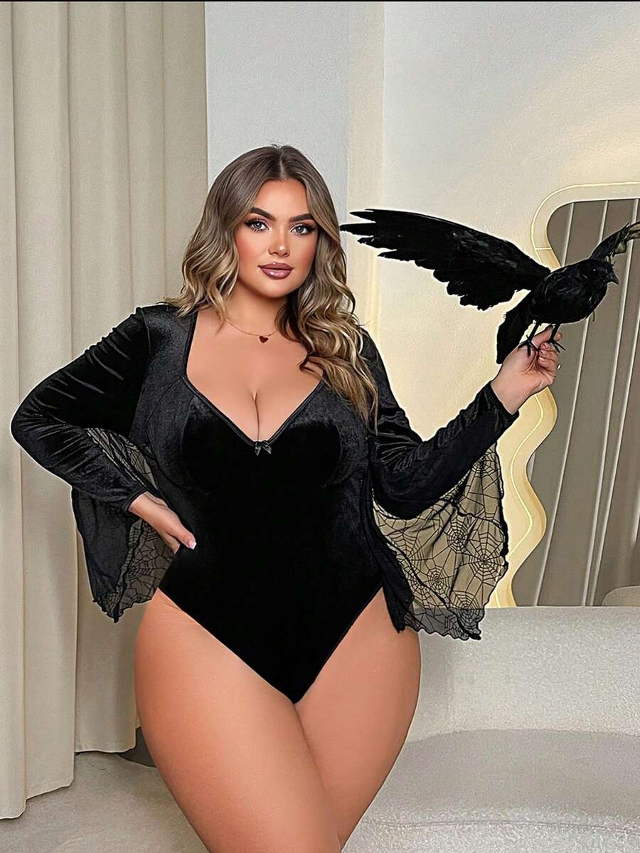 Black plus size underwire teddy lingerie featuring a deep V-neckline, bow detail, and adjustable straps.