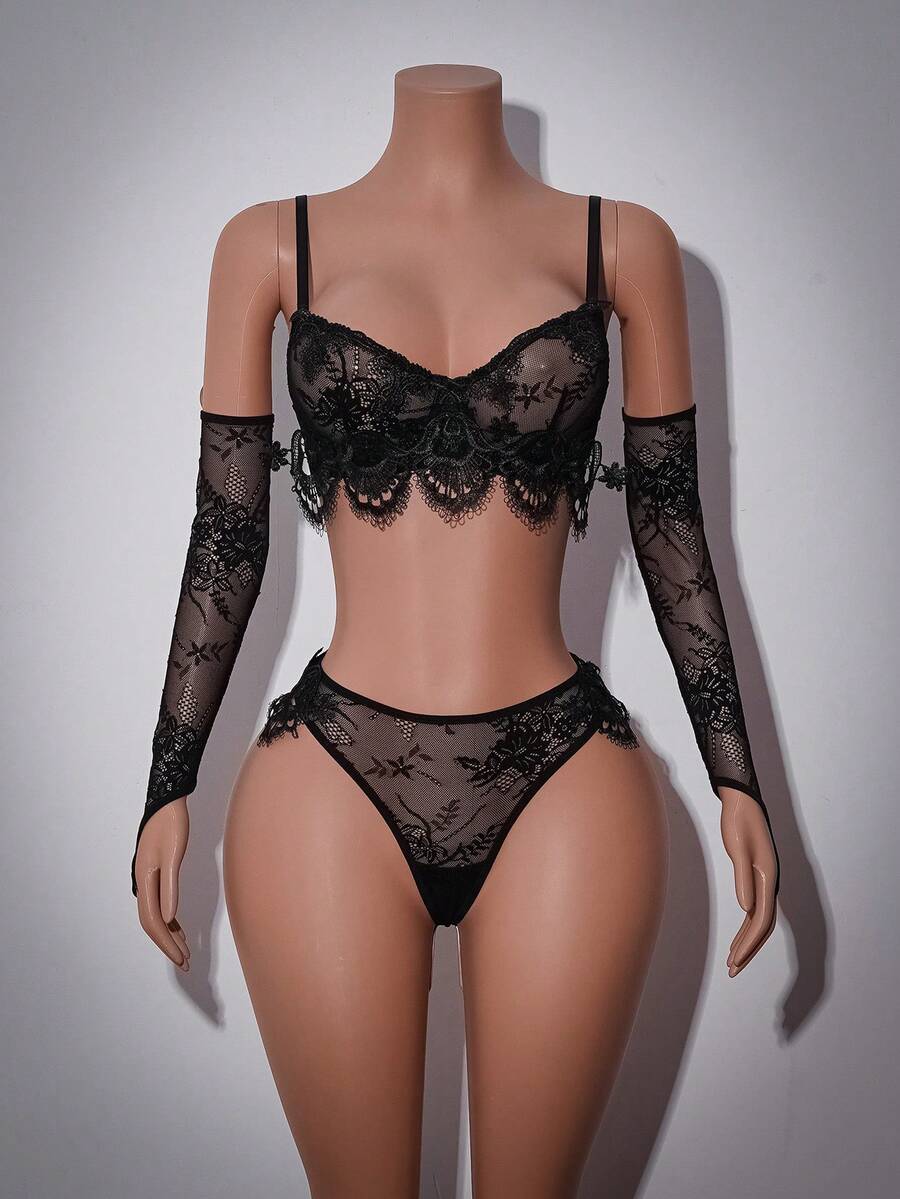 Black gothic lace lingerie set for women featuring underwire bralette with bow detail, adjustable spaghetti straps, and matching low rise briefs.