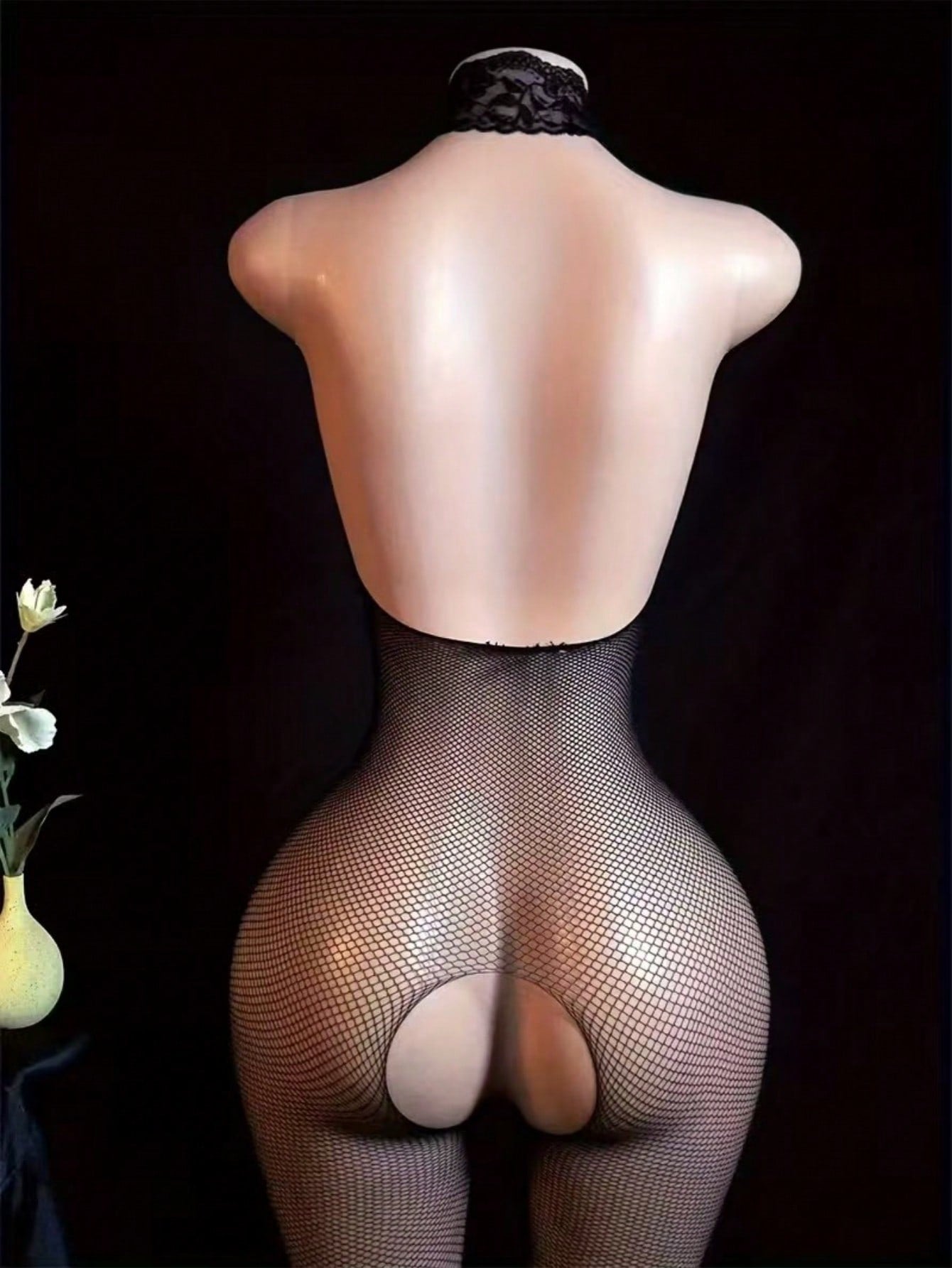 Black sheer fishnet bodystocking for women with cut-out detail, crossback straps, scoop neckline, and sleeveless high-stretch design.