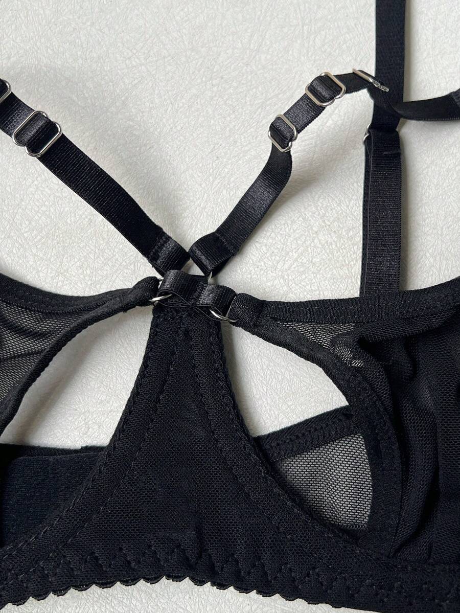 Black semi-sheer cutout 4-piece women's lingerie set featuring a triangle cup bralette with underwire and low-rise thong.