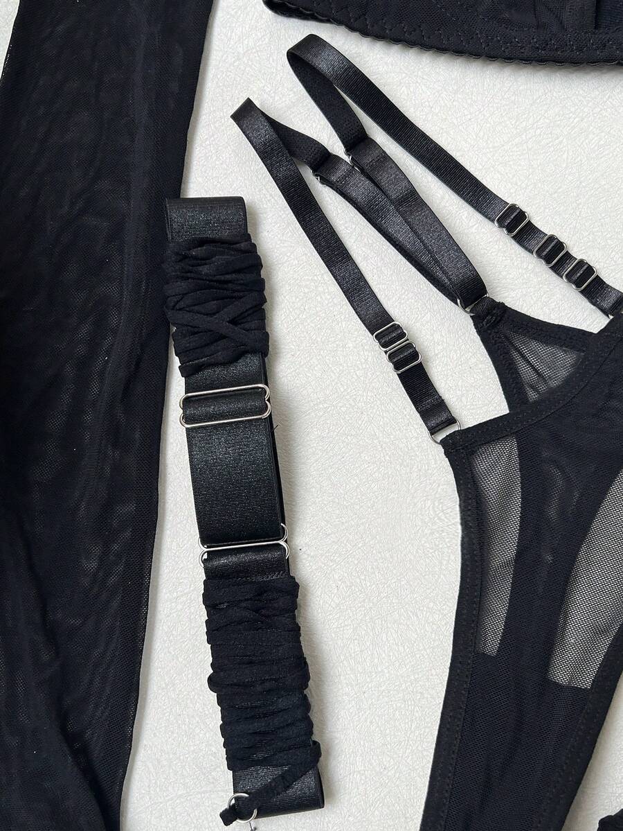 Black semi-sheer cutout 4-piece women's lingerie set featuring a triangle cup bralette with underwire and low-rise thong.
