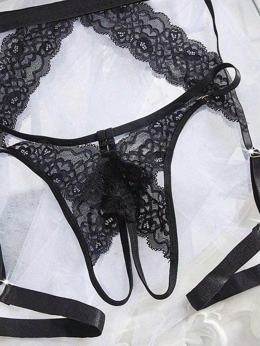 2-piece set of black low rise lace thong panties for women featuring cut out details