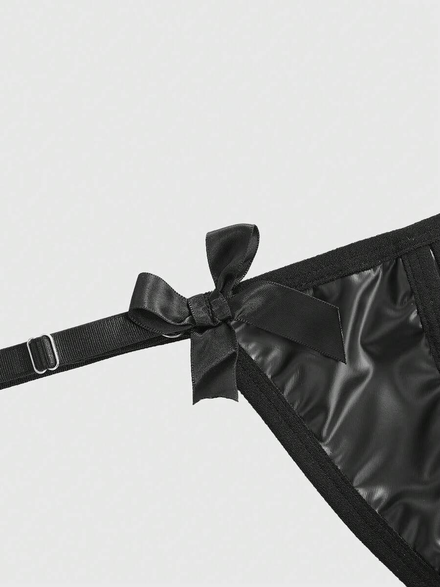 Black women's gothic crotchless thong panties featuring a PU leather bow detail and a heart metal buckle.
