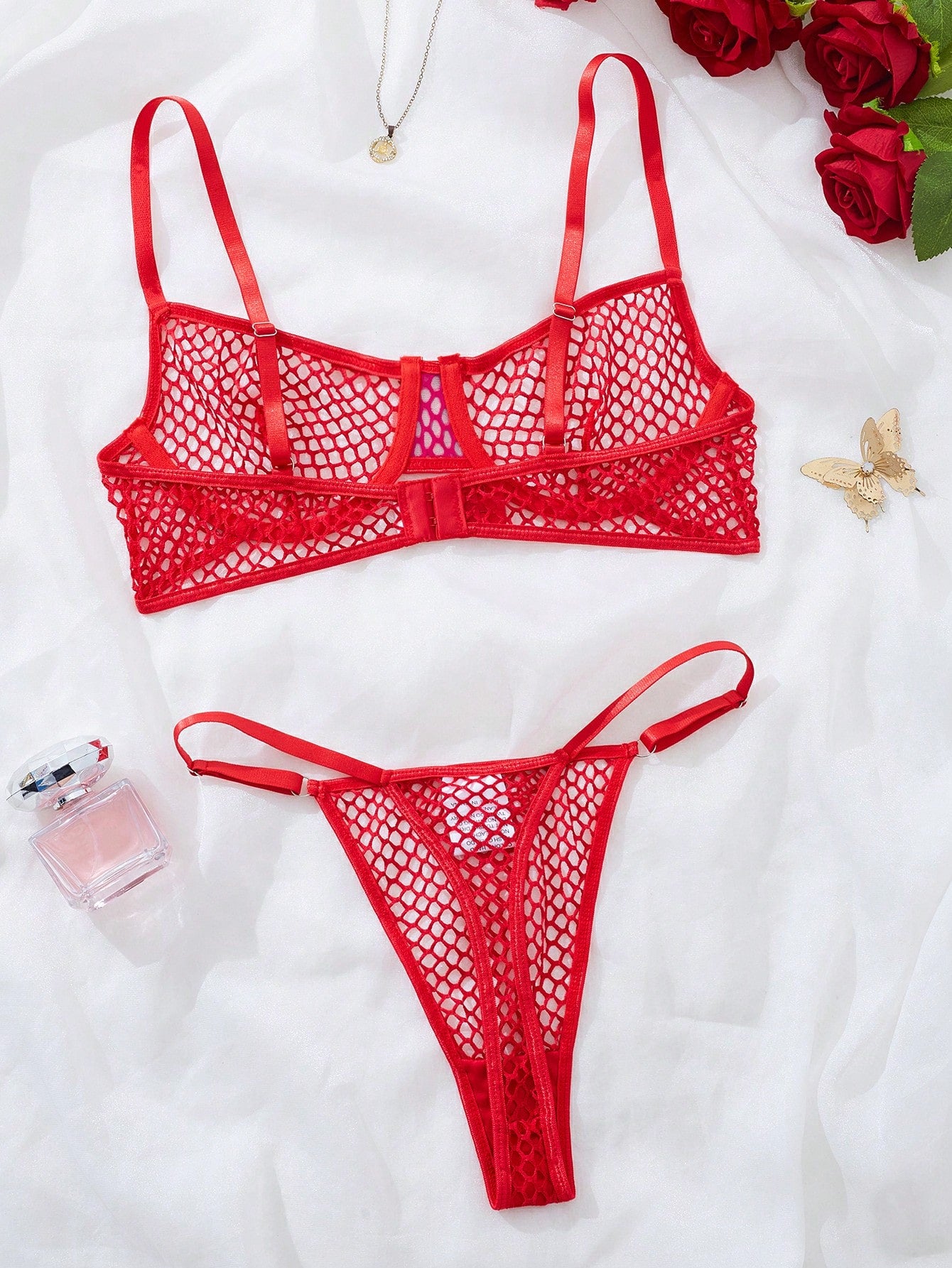 Women's 2-piece mesh lingerie set with hollow out detail, underwire bra, adjustable spaghetti straps, and matching low-rise thong panties in a sheer plain design.