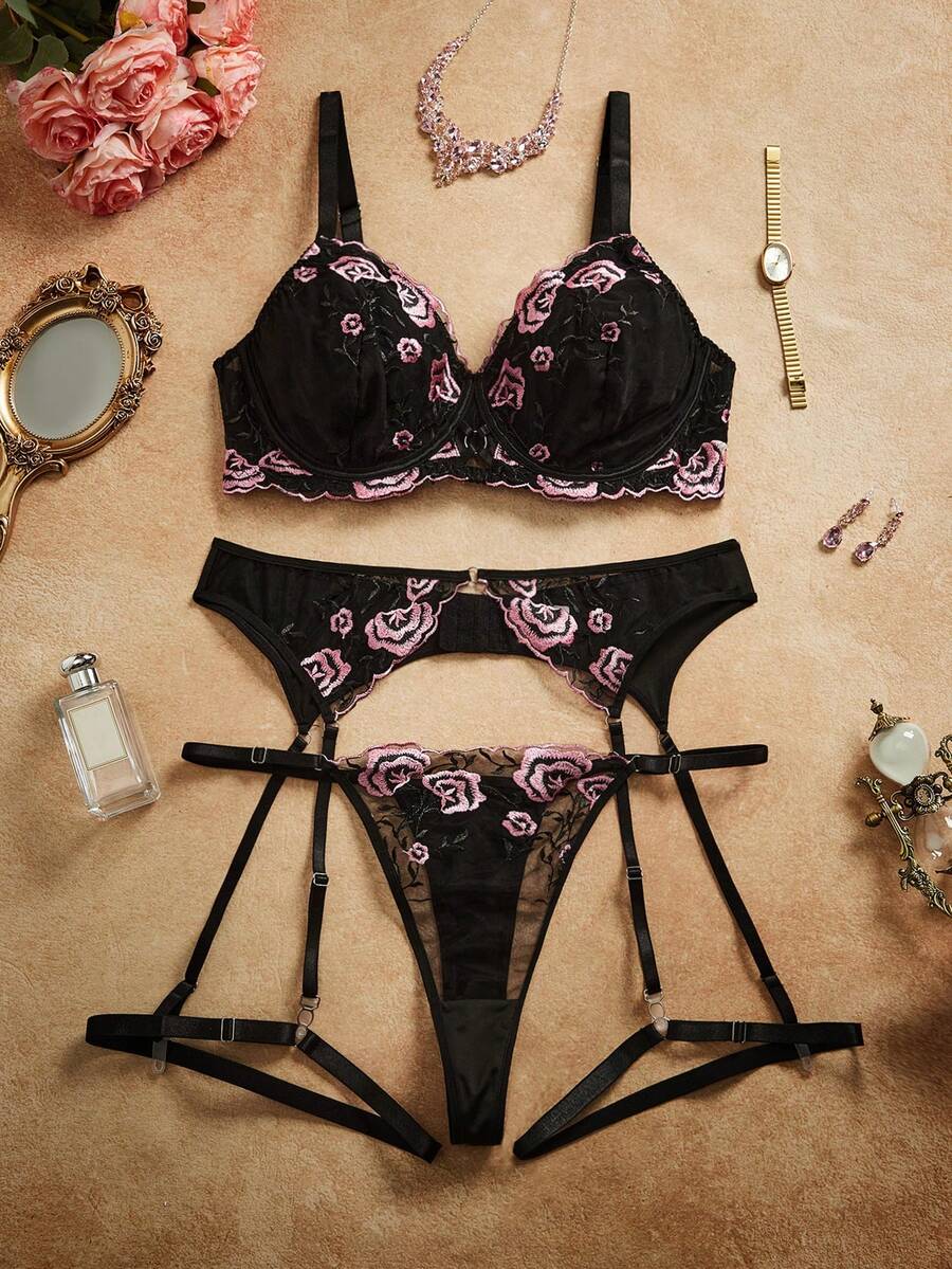 Plus size black babydoll lingerie set with floral embroidery, underwire top, adjustable spaghetti straps, and matching V-string panty.