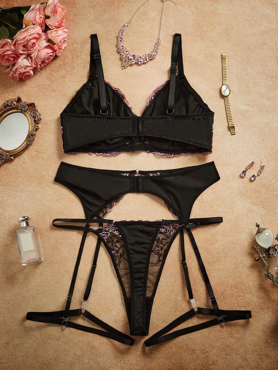 Plus size black babydoll lingerie set with floral embroidery, underwire top, adjustable spaghetti straps, and matching V-string panty.