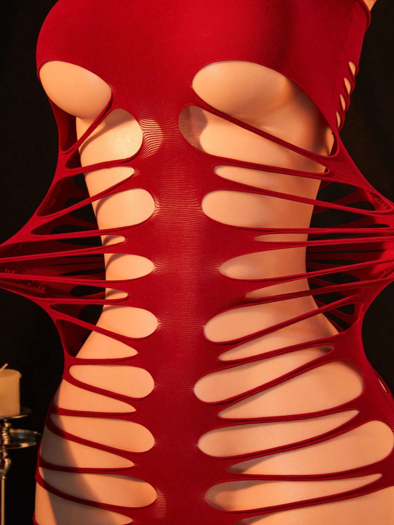 Women's fishnet bodysuit with a strapless sleeveless design, long length, and high-stretch polyamide blend fabric.