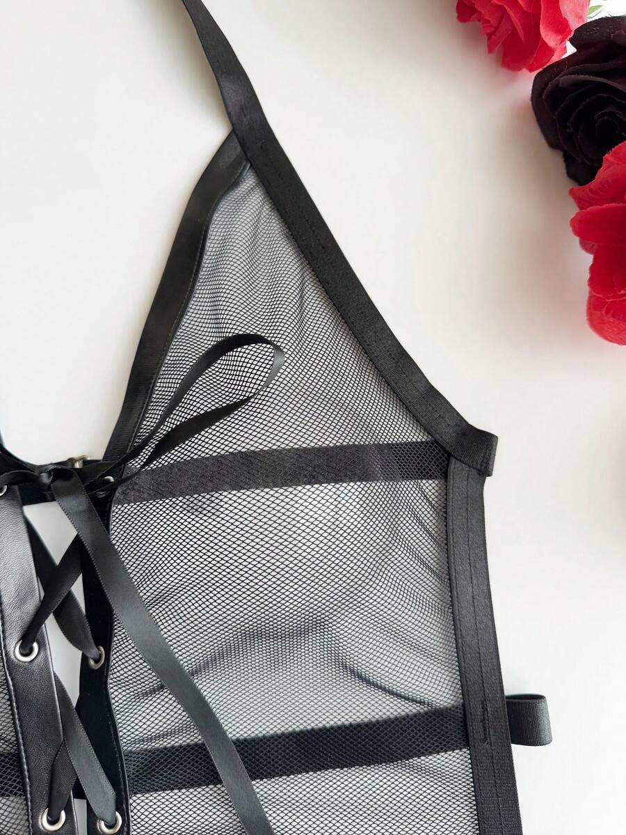 Black halter lingerie bodysuit featuring criss-cross lace-up front details, adjustable shoulder straps, and a low rise thong design.