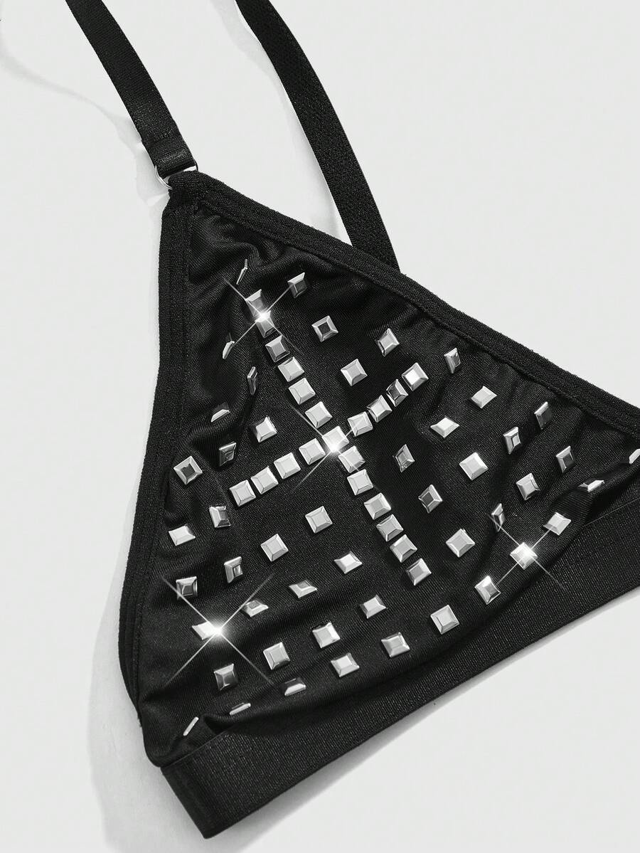 Front view of black gothic cross studded triangle bralette with adjustable spaghetti straps.
