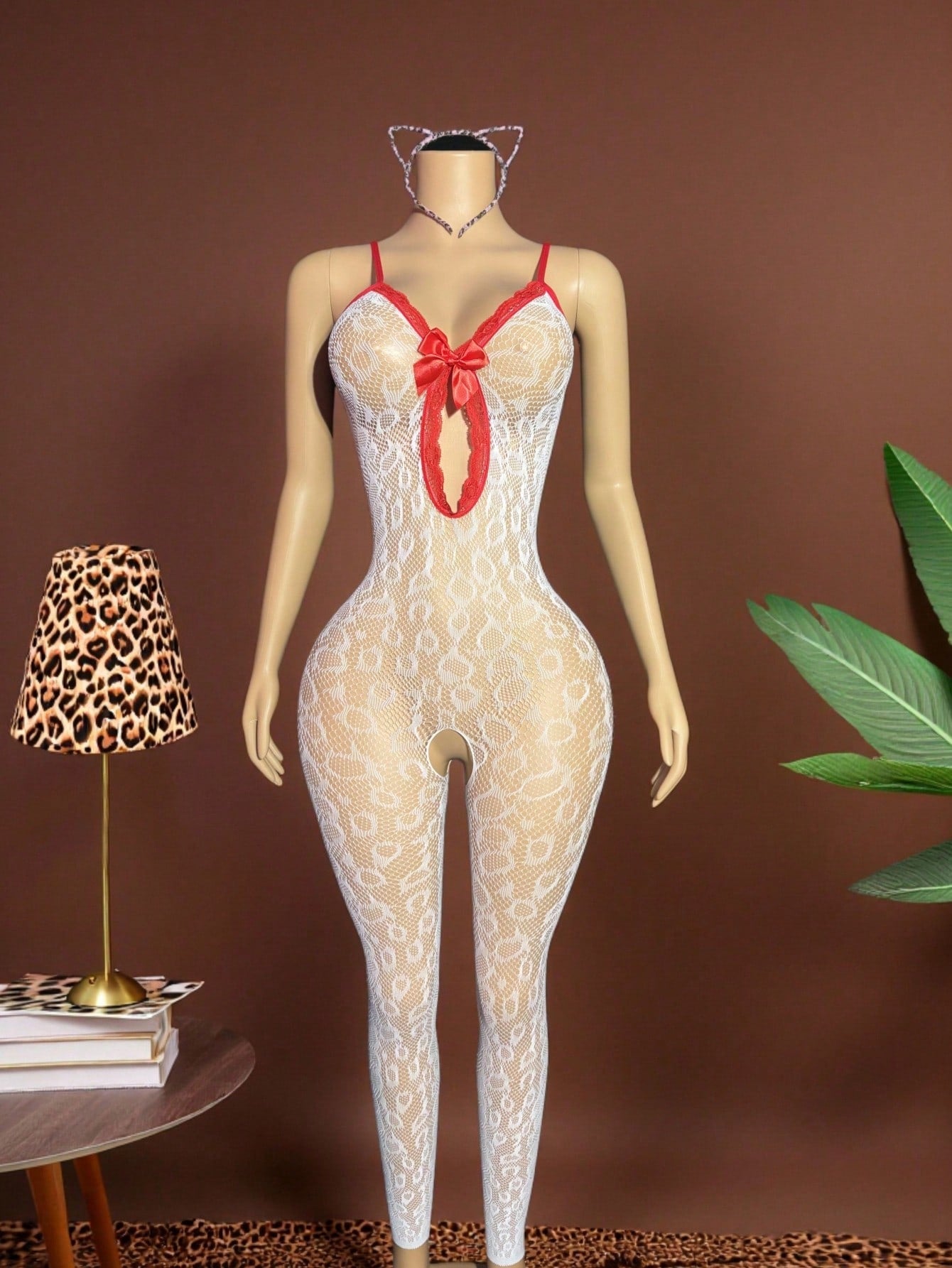 Sleeveless pink lingerie bodysuit 2 piece set with sheer textured fabric, backless design, contrast lace, knot detail, adjustable spaghetti straps, and cropped low rise fit.