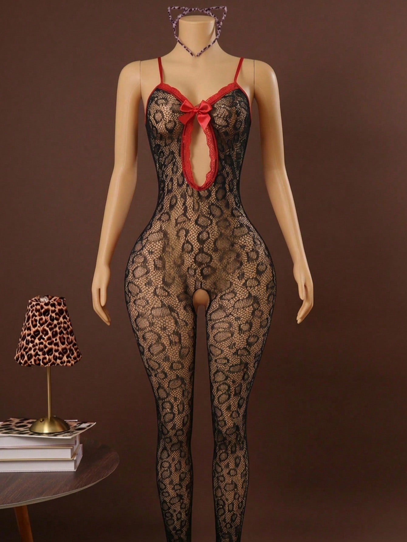 Sleeveless pink lingerie bodysuit 2 piece set with sheer textured fabric, backless design, contrast lace, knot detail, adjustable spaghetti straps, and cropped low rise fit.