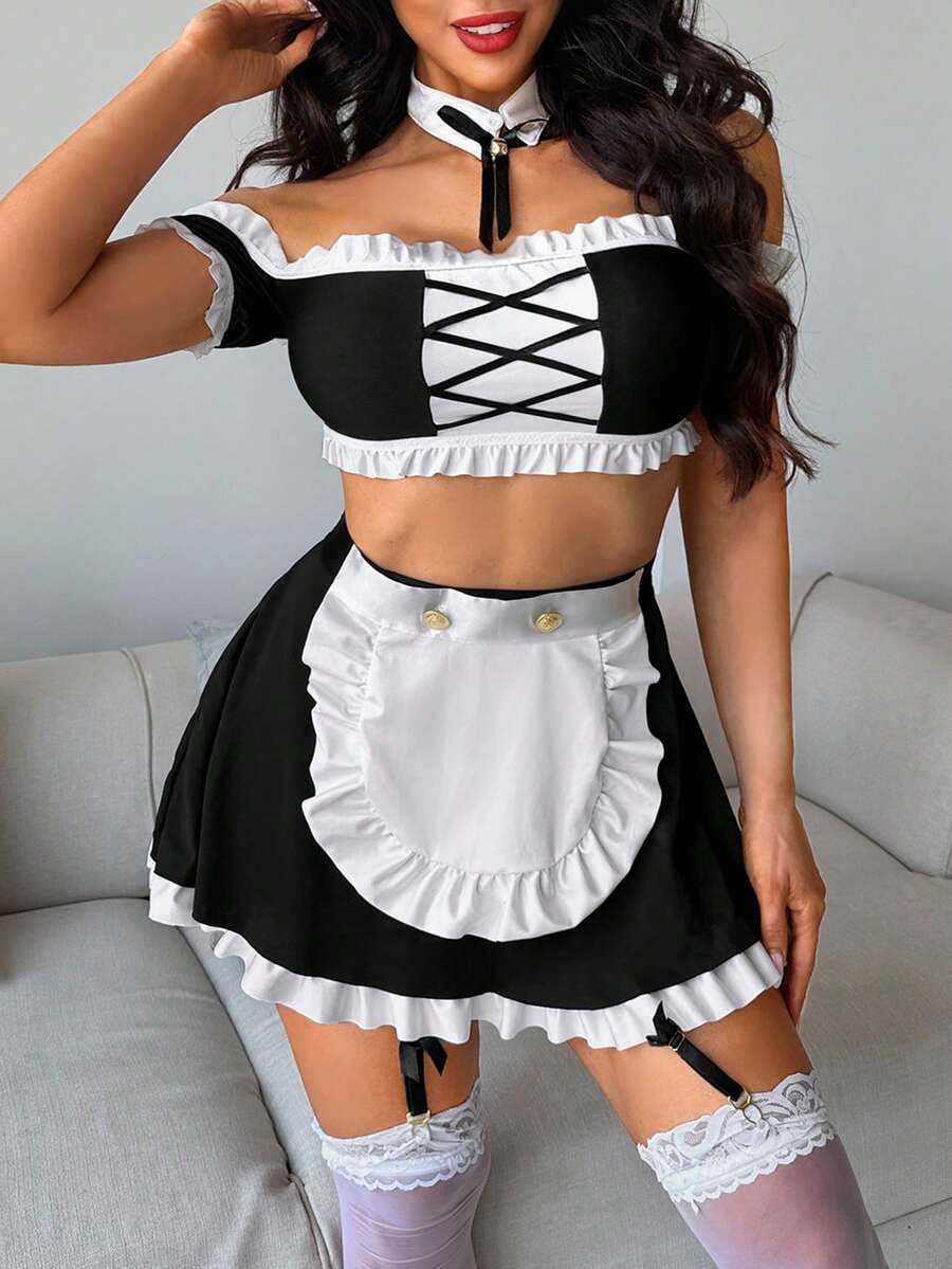 Women's 5-piece black and white cosplay lingerie set including a cold-shoulder top with lace trim, bow-back apron, mini skirt, headband, and bell accessory.