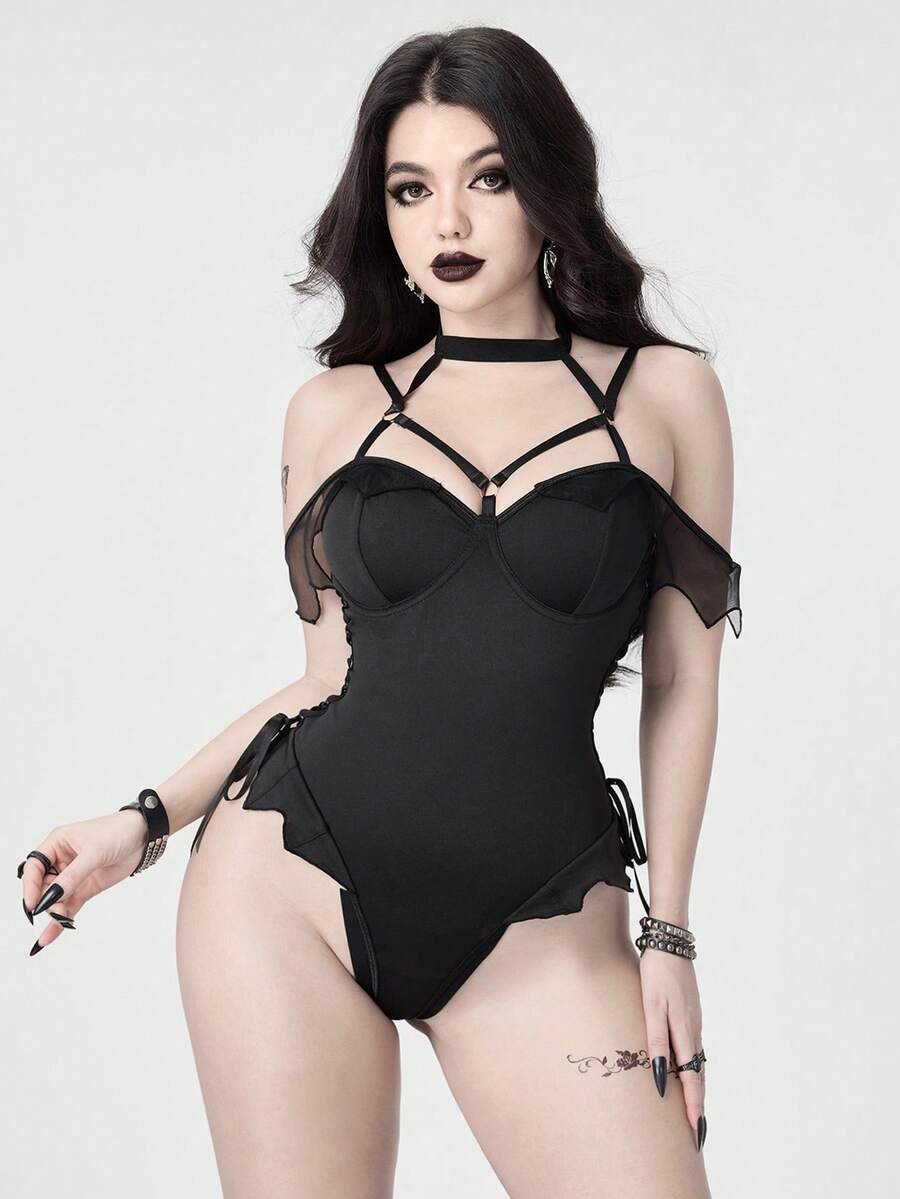 Women's black gothic backless bodysuit featuring a halter neckline with adjustable straps, underwire cup details, and cut out design in knitted fabric.