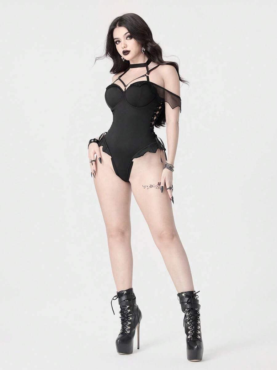 Women's black gothic backless bodysuit featuring a halter neckline with adjustable straps, underwire cup details, and cut out design in knitted fabric.