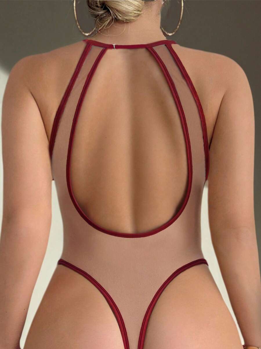 Women's sheer floral mesh teddy camisole featuring cut-out backless design, round neck, adjustable straps, and thong panty in burgundy.