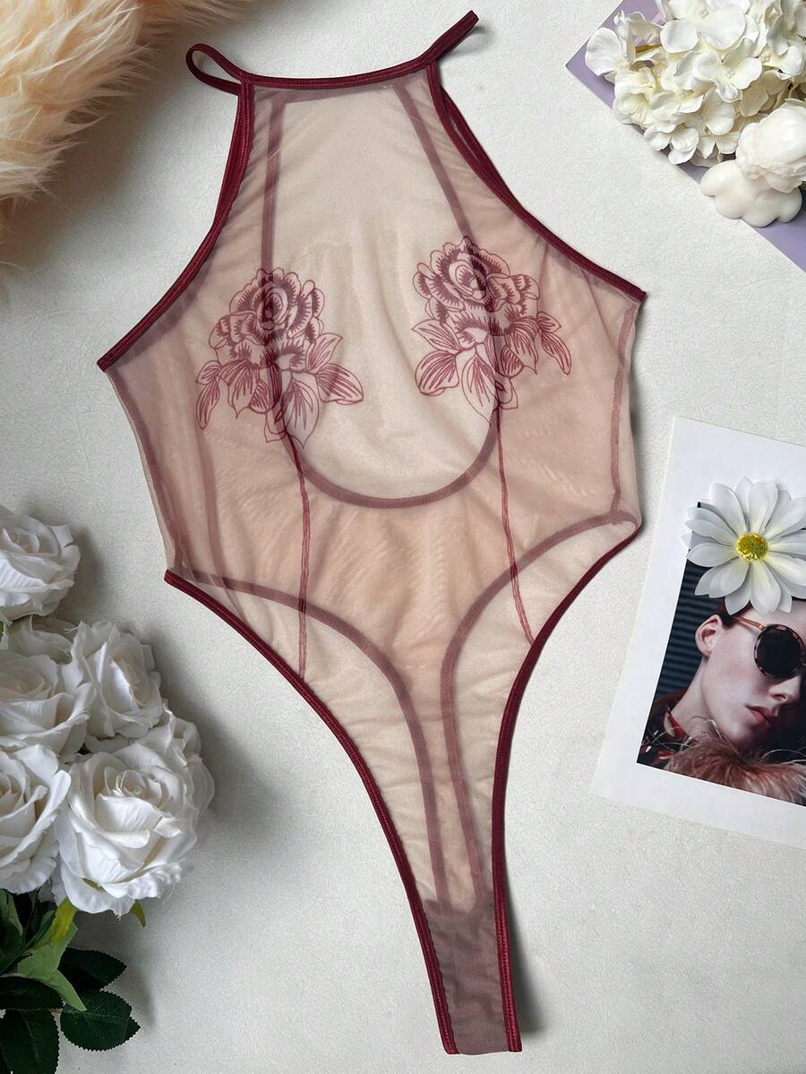 Women's sheer floral mesh teddy camisole featuring cut-out backless design, round neck, adjustable straps, and thong panty in burgundy.