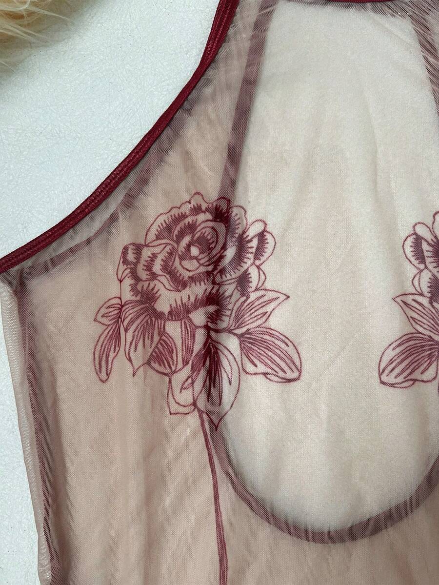 Women's sheer floral mesh teddy camisole featuring cut-out backless design, round neck, adjustable straps, and thong panty in burgundy.