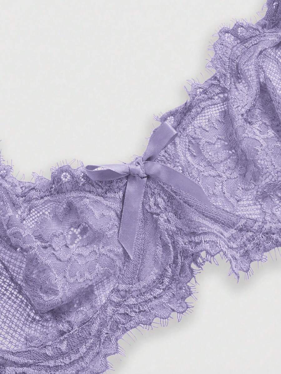 Black sheer floral lace plunge bra featuring underwire support, unlined triangle cups, adjustable straps, and a backless design for women.