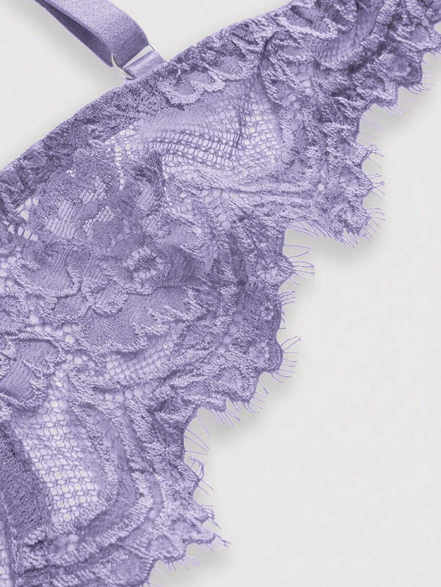 Black sheer floral lace plunge bra featuring underwire support, unlined triangle cups, adjustable straps, and a backless design for women.