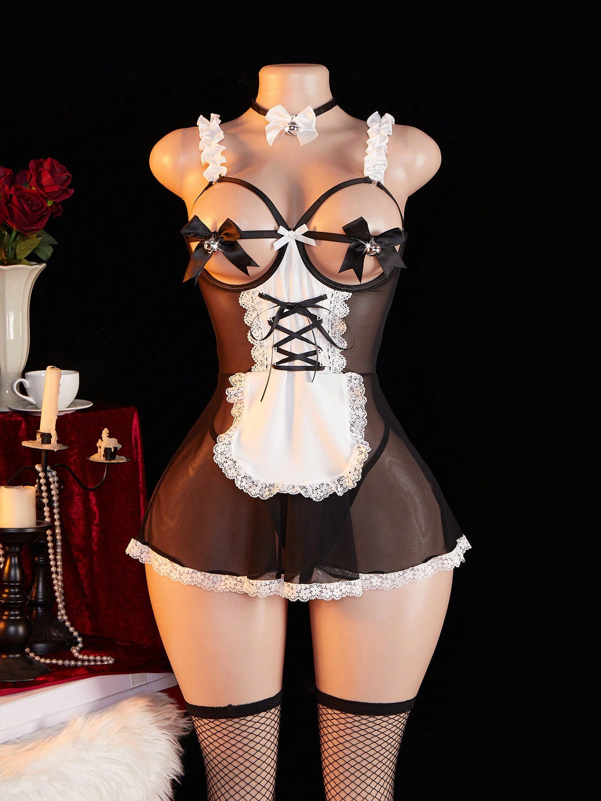 Women's 4-piece black lingerie set featuring a sheer lace nightgown with backless design, adjustable spaghetti straps, fishnet stockings, and matching choker.