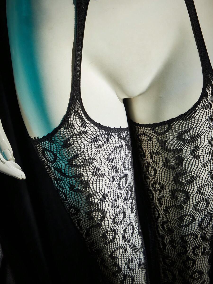 Women's sheer black mesh halter neck lingerie bodysuit with hollow out design and adjustable straps.