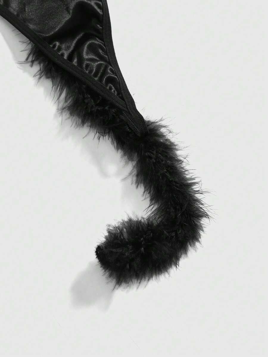Black gothic furry tail thong panties for women featuring a low rise fit in knitted fabric.