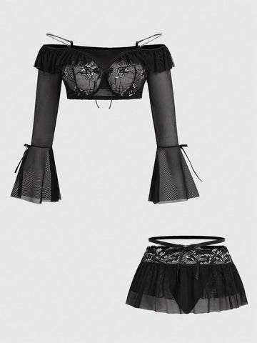 Black plus size gothic lingerie set featuring an off-shoulder bra with metal chain straps, underwire support, low rise thong, and ruffle hem mini skirt.