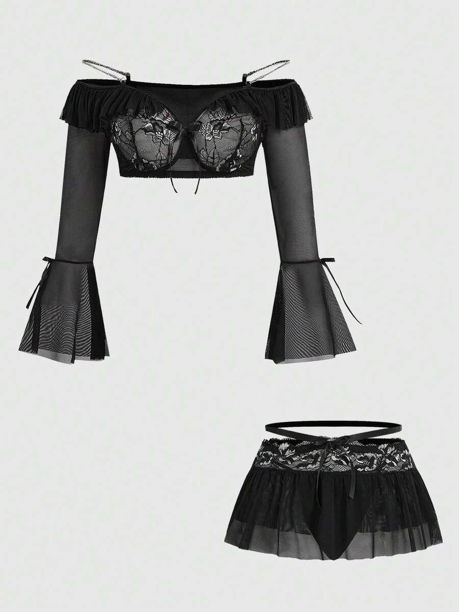 Black plus size gothic lingerie set featuring an off-shoulder bra with metal chain straps, underwire support, low rise thong, and ruffle hem mini skirt.