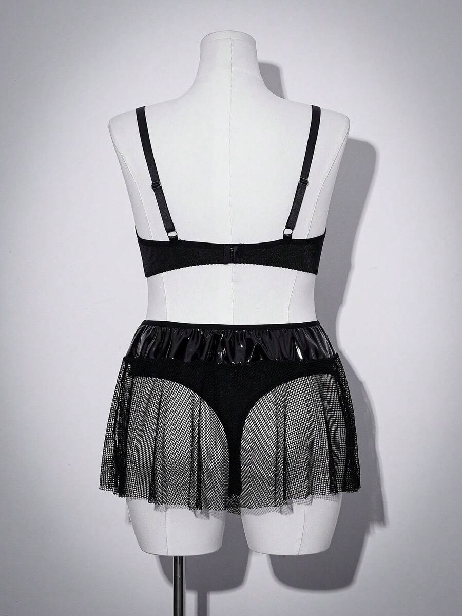 Black plus size lingerie dress featuring backless cup detail with underwire, adjustable spaghetti straps, and mid rise briefs.