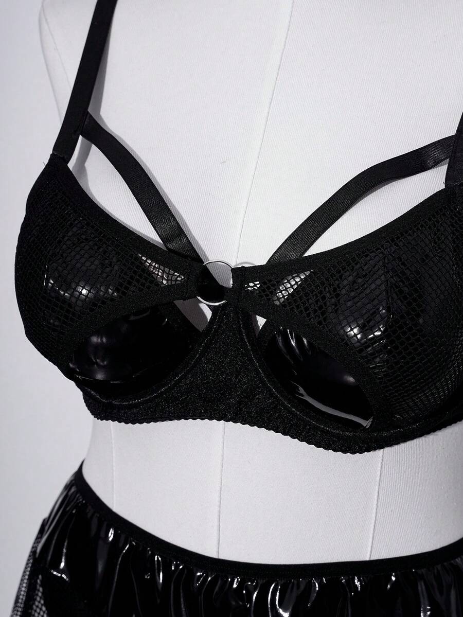 Black plus size lingerie dress featuring backless cup detail with underwire, adjustable spaghetti straps, and mid rise briefs.