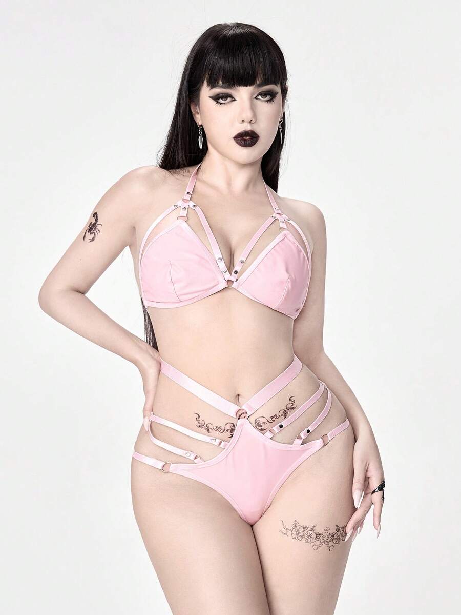 Pink goth 2-piece lingerie set featuring a halter triangle cup bralette with eyelet straps and backless detail paired with a matching mid-rise thong panty.