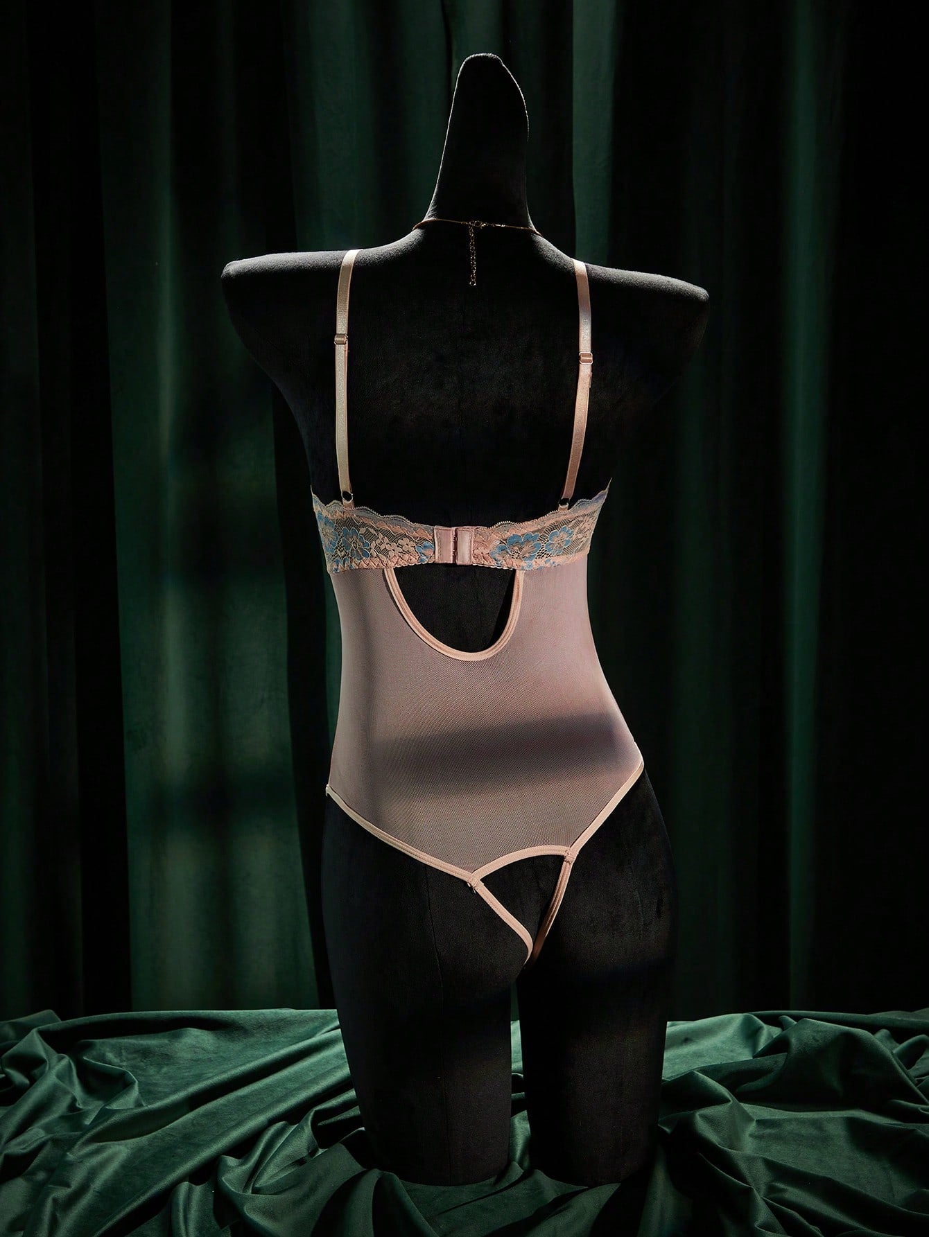 Women's sheer underwire bodysuit teddy in mesh fabric with contrast lace, cut-out detail, adjustable spaghetti straps, and sleeveless design.