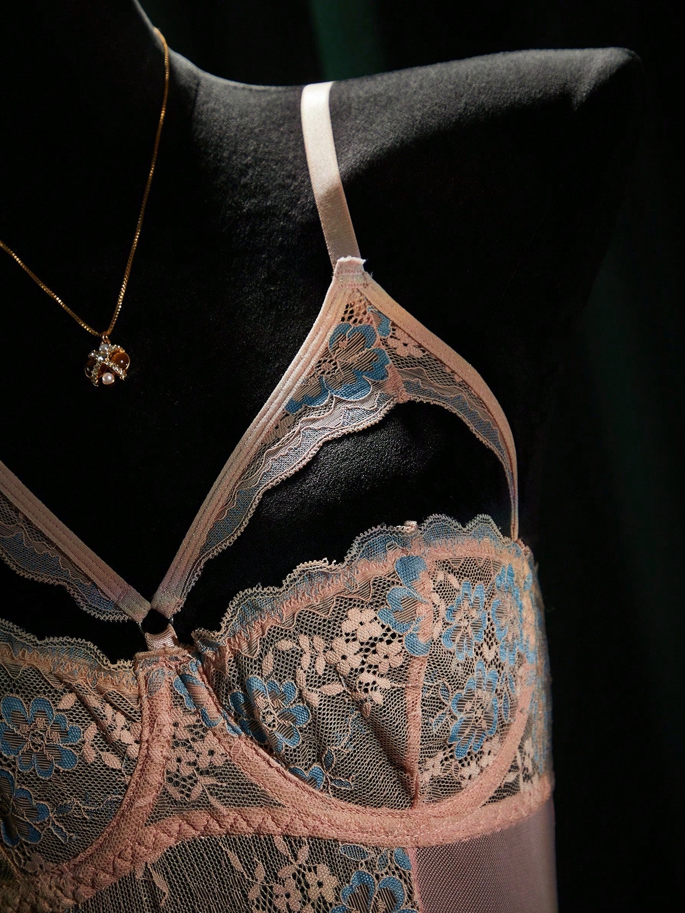 Women's sheer underwire bodysuit teddy in mesh fabric with contrast lace, cut-out detail, adjustable spaghetti straps, and sleeveless design.