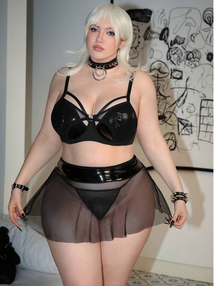 Black plus size lingerie dress featuring backless cup detail with underwire, adjustable spaghetti straps, and mid rise briefs.