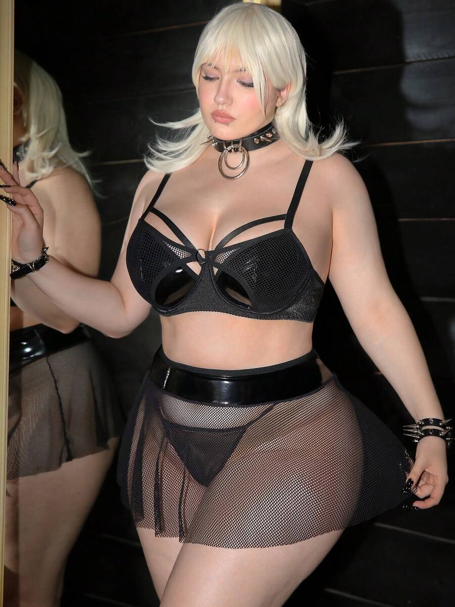Black plus size lingerie dress featuring backless cup detail with underwire, adjustable spaghetti straps, and mid rise briefs.