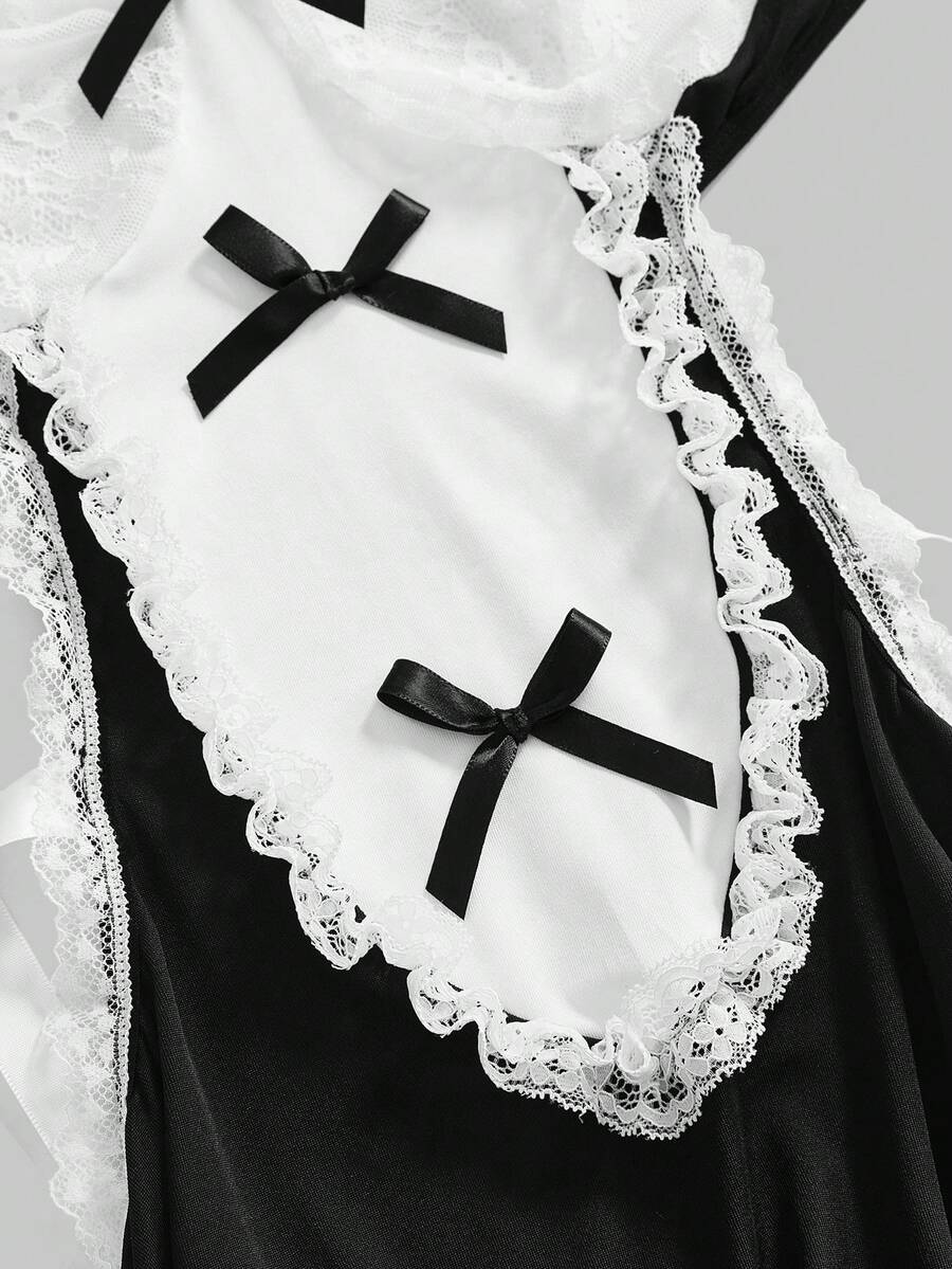 Women's 3-piece black gothic lingerie costume set featuring a contrast lace slip dress with bow decor, ruffle hem, underwire cups, and adjustable spaghetti straps.
