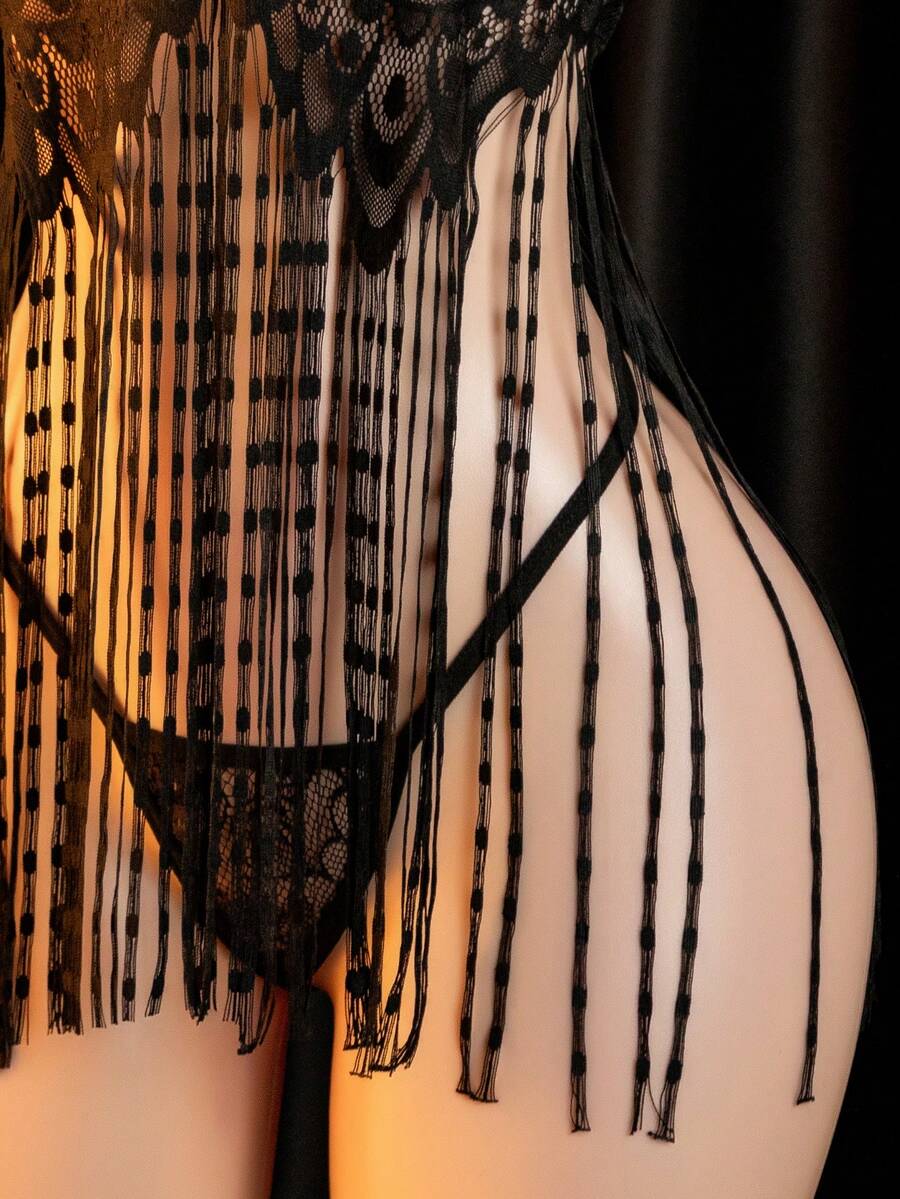 Women's black sheer halter slip dress and matching low-rise V-string 2-piece lingerie set.
