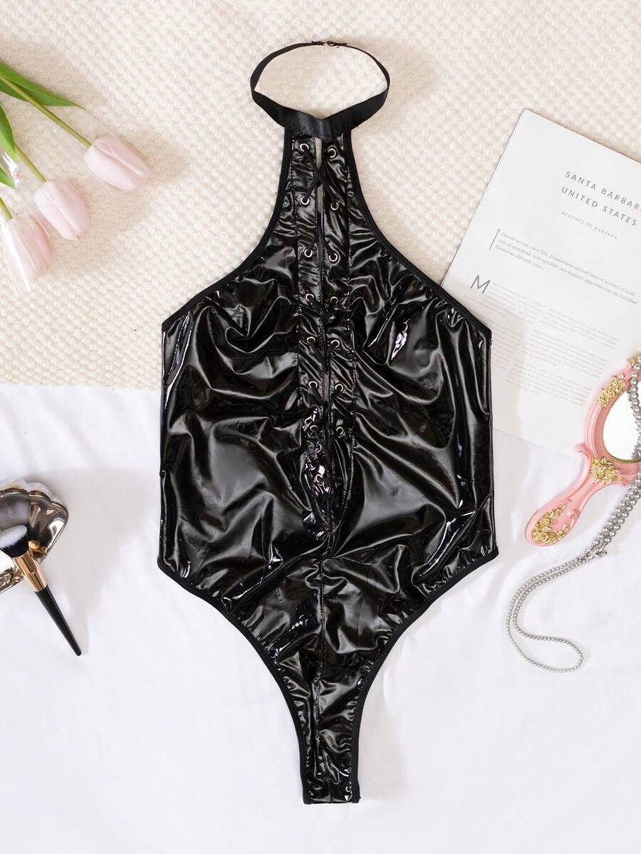 Women's black PU leather halter neck bodysuit lingerie with cut-out front, lace-up detail, and backless crossback straps.