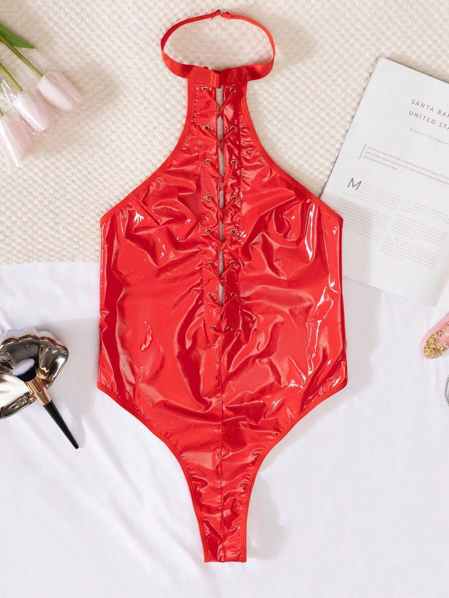 Women's black PU leather halter neck bodysuit lingerie with cut-out front, lace-up detail, and backless crossback straps.