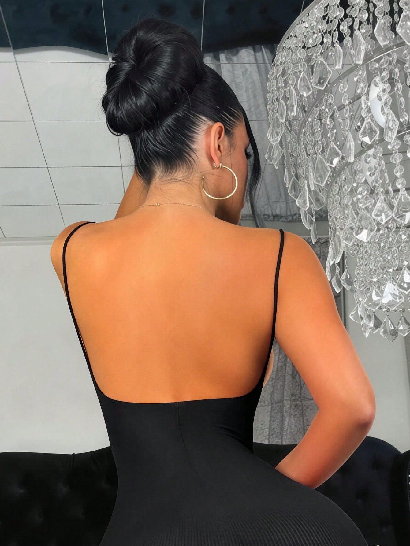 Women's sheer backless lingerie slip dress with spaghetti straps, short length, and high-stretch knitted fabric.