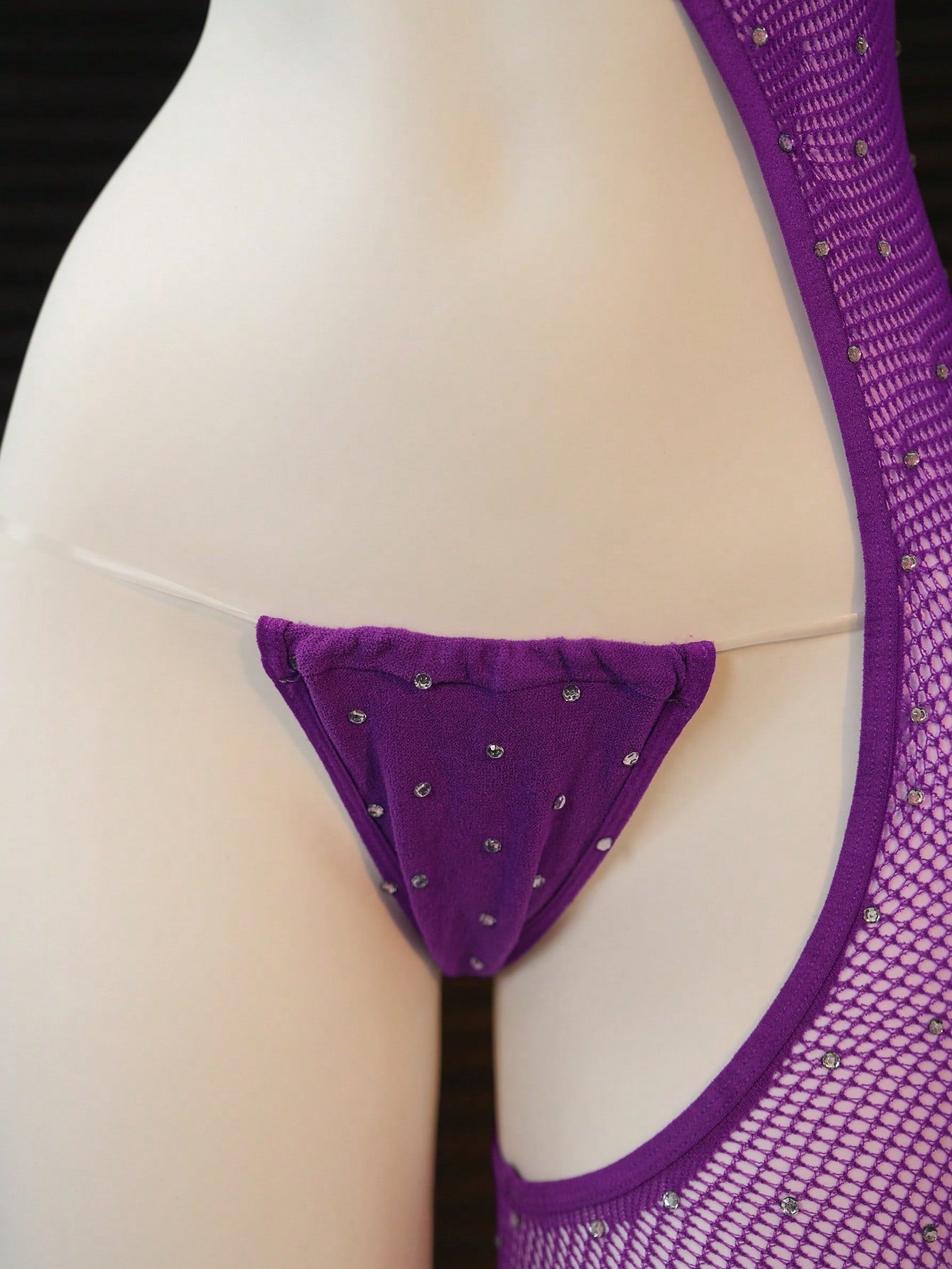 Women's 2-piece sheer lingerie set featuring an asymmetric strapless bodysuit with cut-out rhinestone details and a matching low-rise G-string thong.