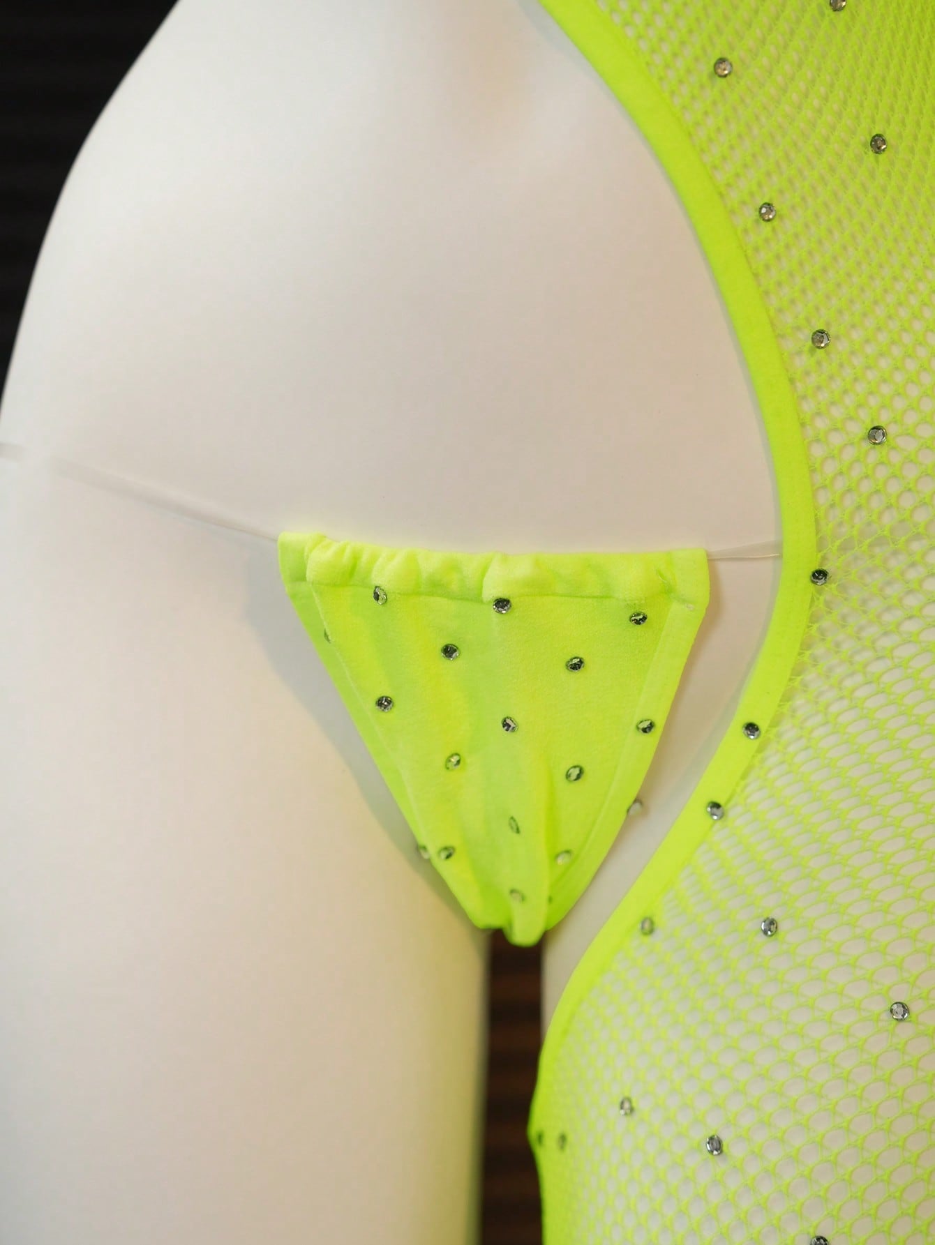 Women's 2-piece sheer lingerie set featuring an asymmetric strapless bodysuit with cut-out rhinestone details and a matching low-rise G-string thong.