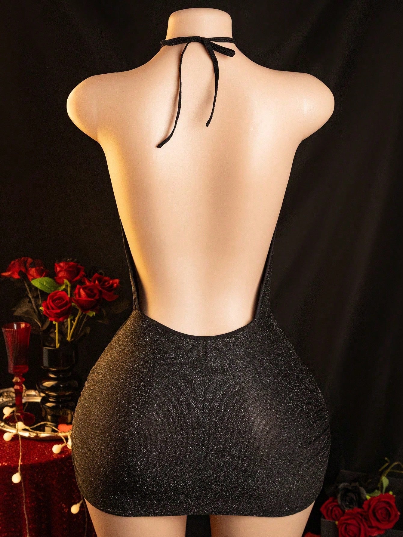 Black women's shiny hollow out lingerie set with halter short slip dress and matching low-rise G-string, 2-piece polyester elastane intimate apparel set.